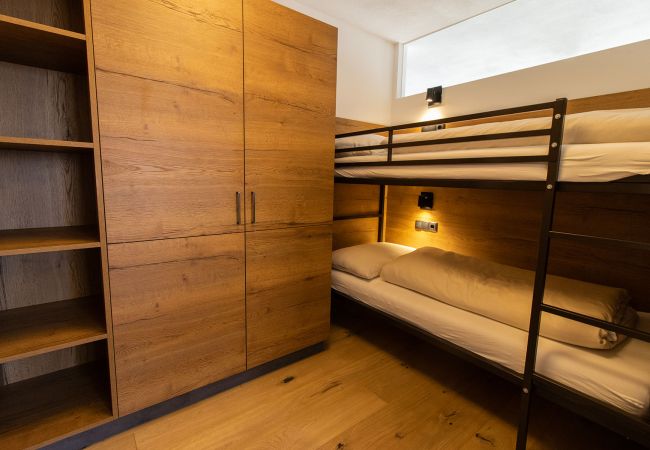 Ferienwohnung in Mariapfarr - Apartment SATURN mit Durchgangszimmer und Etagenbett 